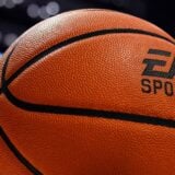 A basketball with the EA logo on it appears in a court.